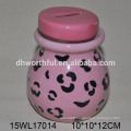 Ceramic coin bank with hanging ornament in bright color